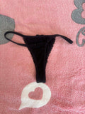 Zwarte string.